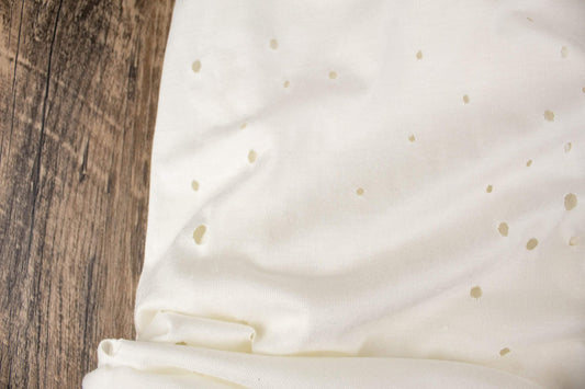 Off White Lasercut Distress Hole Knit Jersey Fabric by the yard ATK00500R - Felinus Fabrics