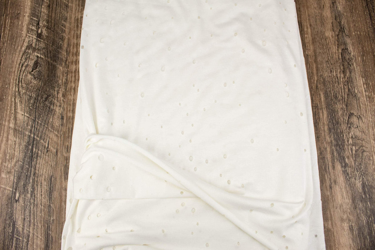 Off White Lasercut Distress Hole Knit Jersey Fabric by the yard ATK00500R - Felinus Fabrics